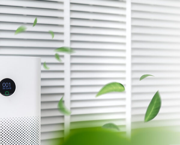 air purifier a living room, air cleaner removing fine dust in house. protect PM 2.5 dust and air pollution concept