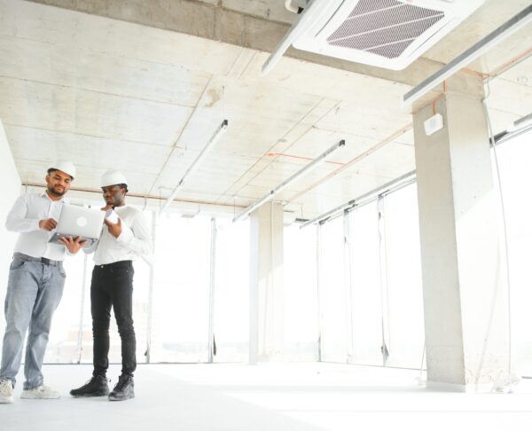 Group of multi ethnic engineer construction site worker meeting at workplace.